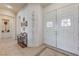 Bright hallway with tile flooring, decorative art, and direct access to the main living areas at 4636 Riva De Romanza St, Las Vegas, NV 89135