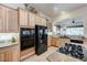 Kitchen with stainless steel appliances, granite countertops, and custom wood cabinets at 4636 Riva De Romanza St, Las Vegas, NV 89135