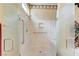 Close-up of a fully enclosed glass shower with accessibility features and marble-like walls at 4636 Riva De Romanza St, Las Vegas, NV 89135