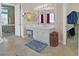 Bathroom with tile flooring, vanity with dual sinks, and separate access to walk-in closet at 4724 Stavanger Ln, Las Vegas, NV 89147