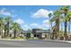 The community entrance is lined with tall palm trees and features an elegant gated entrance at 4724 Stavanger Ln, Las Vegas, NV 89147