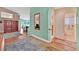 Hallway showcasing hardwood floors, a mirror, and entryways to the adjacent rooms at 4724 Stavanger Ln, Las Vegas, NV 89147