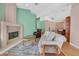 Cozy living room with a fireplace, hardwood floors, and comfortable seating arrangements at 4724 Stavanger Ln, Las Vegas, NV 89147
