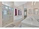 Main bathroom features a glass shower, soaking tub, and ample counter space at 4724 Stavanger Ln, Las Vegas, NV 89147