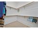 Spacious walk-in closet with wrap-around hanging racks and ample storage space at 4724 Stavanger Ln, Las Vegas, NV 89147