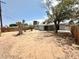 Spacious backyard features a mature tree, providing ample shade and privacy at 4924 Carmen Blvd, Las Vegas, NV 89108