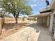 Large backyard featuring a patio and mature trees, perfect for relaxation and outdoor enjoyment at 4924 Carmen Blvd, Las Vegas, NV 89108