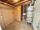 Unfinished basement with water heater and plumbing features, perfect for customization at 4924 Carmen Blvd, Las Vegas, NV 89108