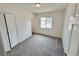 Carpeted bedroom with natural light, a standard closet and neutral paint at 4924 Carmen Blvd, Las Vegas, NV 89108
