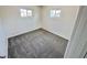 Cozy carpeted bedroom with two windows allowing for great natural light at 4924 Carmen Blvd, Las Vegas, NV 89108