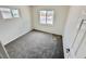 Bedroom with carpeting and multiple windows allowing for natural light at 4924 Carmen Blvd, Las Vegas, NV 89108