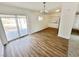 Cozy dining room with hardwood floors, sliding glass doors, and access to the kitchen at 4924 Carmen Blvd, Las Vegas, NV 89108