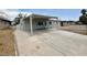 Single-story home featuring a covered carport, fresh exterior paint, and spacious driveway at 4924 Carmen Blvd, Las Vegas, NV 89108