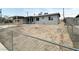 Newly renovated single-story house with xeriscaped front yard and chain-link fence at 4924 Carmen Blvd, Las Vegas, NV 89108