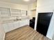 Charming kitchen with white cabinets, stylish countertops, and sleek black appliances at 4924 Carmen Blvd, Las Vegas, NV 89108