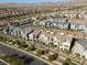 Townhome community features desert landscaping, street access, and mountain views at 494 Mahogany Ridge St, Las Vegas, NV 89138