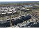 Expansive aerial view of a well-planned community with modern townhomes and manicured streets in a desirable location at 494 Mahogany Ridge St, Las Vegas, NV 89138