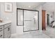 Modern bathroom featuring a glass-enclosed shower with black trim and sleek fixtures at 494 Mahogany Ridge St, Las Vegas, NV 89138