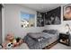 A cozy bedroom with natural light and unique wall art at 494 Mahogany Ridge St, Las Vegas, NV 89138