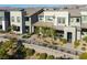 Stylish townhome showcasing a contemporary design, desert landscaping, and inviting covered porch at 494 Mahogany Ridge St, Las Vegas, NV 89138