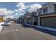 Neighborhood street view showcasing modern townhomes and a well-maintained street at 494 Mahogany Ridge St, Las Vegas, NV 89138