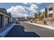 Picturesque street view of modern homes in a suburban neighborhood, with lush landscaping at 494 Mahogany Ridge St, Las Vegas, NV 89138