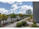 Landscaped street view with sidewalk, street lamps, and lush green trees at 494 Mahogany Ridge St, Las Vegas, NV 89138