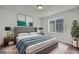 Elegant bedroom showcases a comfortable bed, stylish decor and relaxing ambiance at 5232 Mountain Garland Ln, North Las Vegas, NV 89081