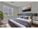 Bedroom features neutral tones, plush bedding and natural light at 5232 Mountain Garland Ln, North Las Vegas, NV 89081