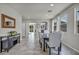 Bright dining room boasts elegant furnishings, tile flooring and a decorative mirror at 5232 Mountain Garland Ln, North Las Vegas, NV 89081
