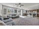 Open living room and kitchen featuring stainless steel appliances, granite countertops, and an island with barstool seating at 5232 Mountain Garland Ln, North Las Vegas, NV 89081