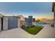 Backyard features a pool, storage shed, solar panels and an artificial grass section at 528 Lavina Ct, Las Vegas, NV 89123