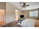 This bedroom offers a ceiling fan, plush carpet and easy access to the Primary bathroom at 528 Lavina Ct, Las Vegas, NV 89123