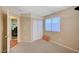 This bedroom has a double-door closet, soft carpet and a window that brings in natural light at 528 Lavina Ct, Las Vegas, NV 89123