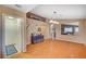 Open-concept dining room with hardwood floors, ample natural light, and easy access to the kitchen and living areas at 528 Lavina Ct, Las Vegas, NV 89123