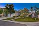 Inviting home featuring a lush lawn, mature trees, and manicured landscaping in a desirable neighborhood at 528 Lavina Ct, Las Vegas, NV 89123