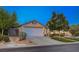 Charming single-story home with a well-manicured front yard, desert landscaping and a two-car garage at 528 Lavina Ct, Las Vegas, NV 89123
