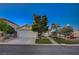 Charming home with a two-car garage, neat landscaping, and a welcoming walkway at 528 Lavina Ct, Las Vegas, NV 89123