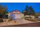 Charming single-story home with a well-manicured front yard, desert landscaping and a two-car garage at 528 Lavina Ct, Las Vegas, NV 89123