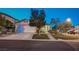 Lovely home with a manicured lawn, mature trees, and a two-car garage in a quiet neighborhood at 528 Lavina Ct, Las Vegas, NV 89123