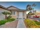 Inviting front entrance with lush landscaping, a charming walkway, and a welcoming front door with great curb appeal at 528 Lavina Ct, Las Vegas, NV 89123