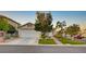 Charming single-story home featuring a well-manicured lawn and inviting two-car garage with mature landscaping at 528 Lavina Ct, Las Vegas, NV 89123