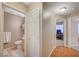 Hallway showcases hardwood floors and doorways to the bathroom and another bedroom at 528 Lavina Ct, Las Vegas, NV 89123