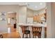 Charming kitchen area with breakfast bar, natural cabinets, and modern appliances at 528 Lavina Ct, Las Vegas, NV 89123