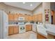 Bright kitchen with natural cabinets, tile backsplash, and modern appliances at 528 Lavina Ct, Las Vegas, NV 89123