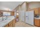 Bright kitchen boasts tile floors, recessed lighting, and white appliances for a clean and welcoming space at 528 Lavina Ct, Las Vegas, NV 89123