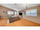 Cozy living room with wood floors, comfortable seating, and ample natural light at 528 Lavina Ct, Las Vegas, NV 89123