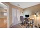 This home office includes carpet flooring, a work desk and double-door closet, perfect for organization at 528 Lavina Ct, Las Vegas, NV 89123