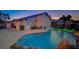 Scenic backyard featuring a refreshing pool, a patio area, and solar panel equipment for a fun space for Gathering and friends at 528 Lavina Ct, Las Vegas, NV 89123