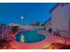 Beautifully lit pool at twilight showcasing an outdoor entertaining area and serene ambiance for evening relaxation at 528 Lavina Ct, Las Vegas, NV 89123